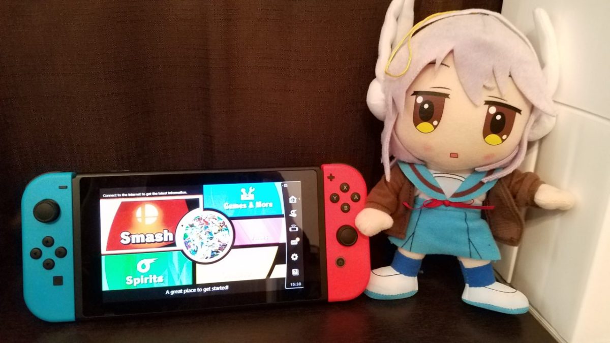 Headphones Nagato posing with a Nintendo Switch.